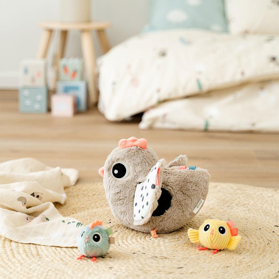 Done by Deer Hide and Seek Activity Toy Clucky - Beige