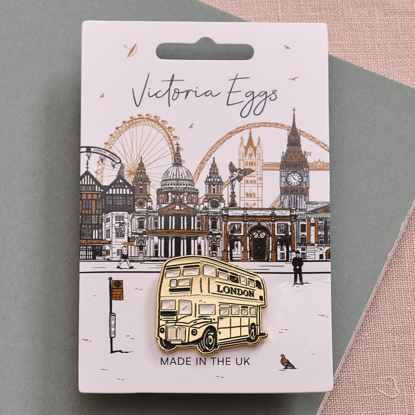 Victoria Eggs Gold Bus Pin Badge